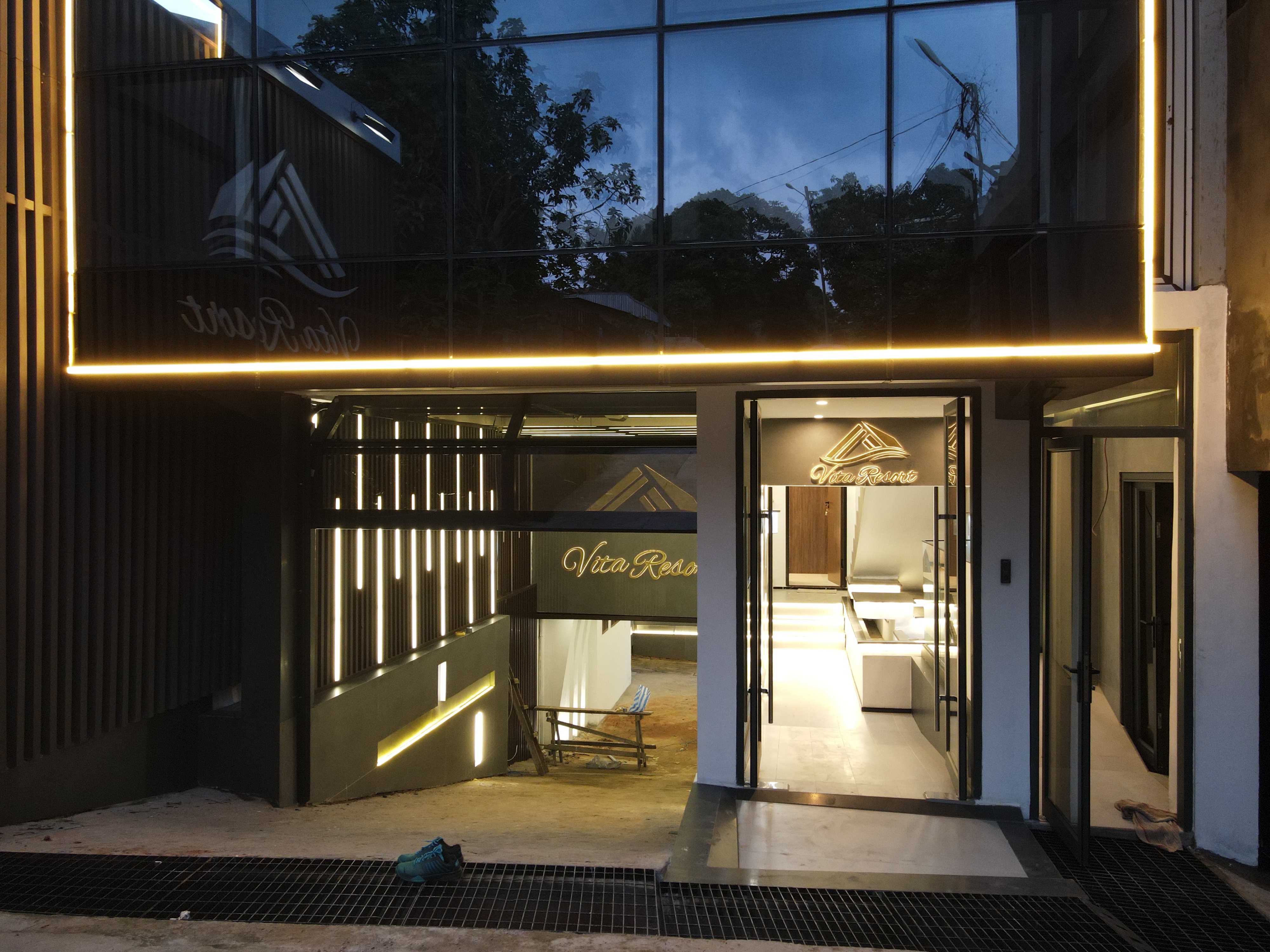 Vita Resort facade with LED ribbons at dusk, Golf Bastos, Yaoundé