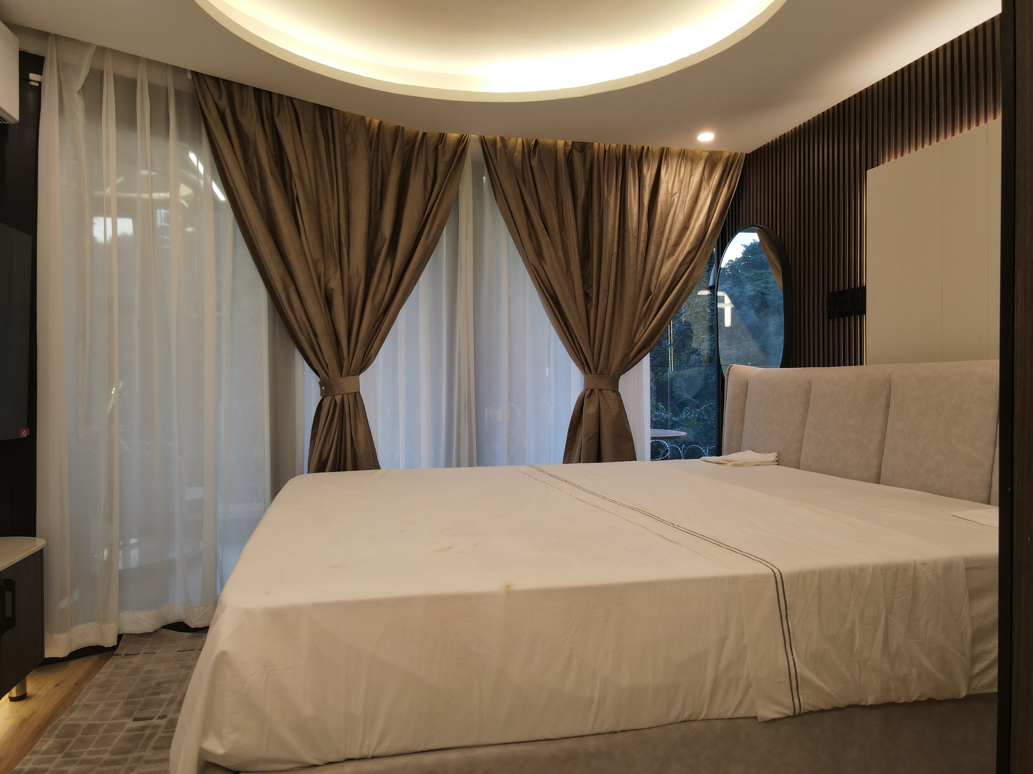 Evening bedroom ambiance with forest view