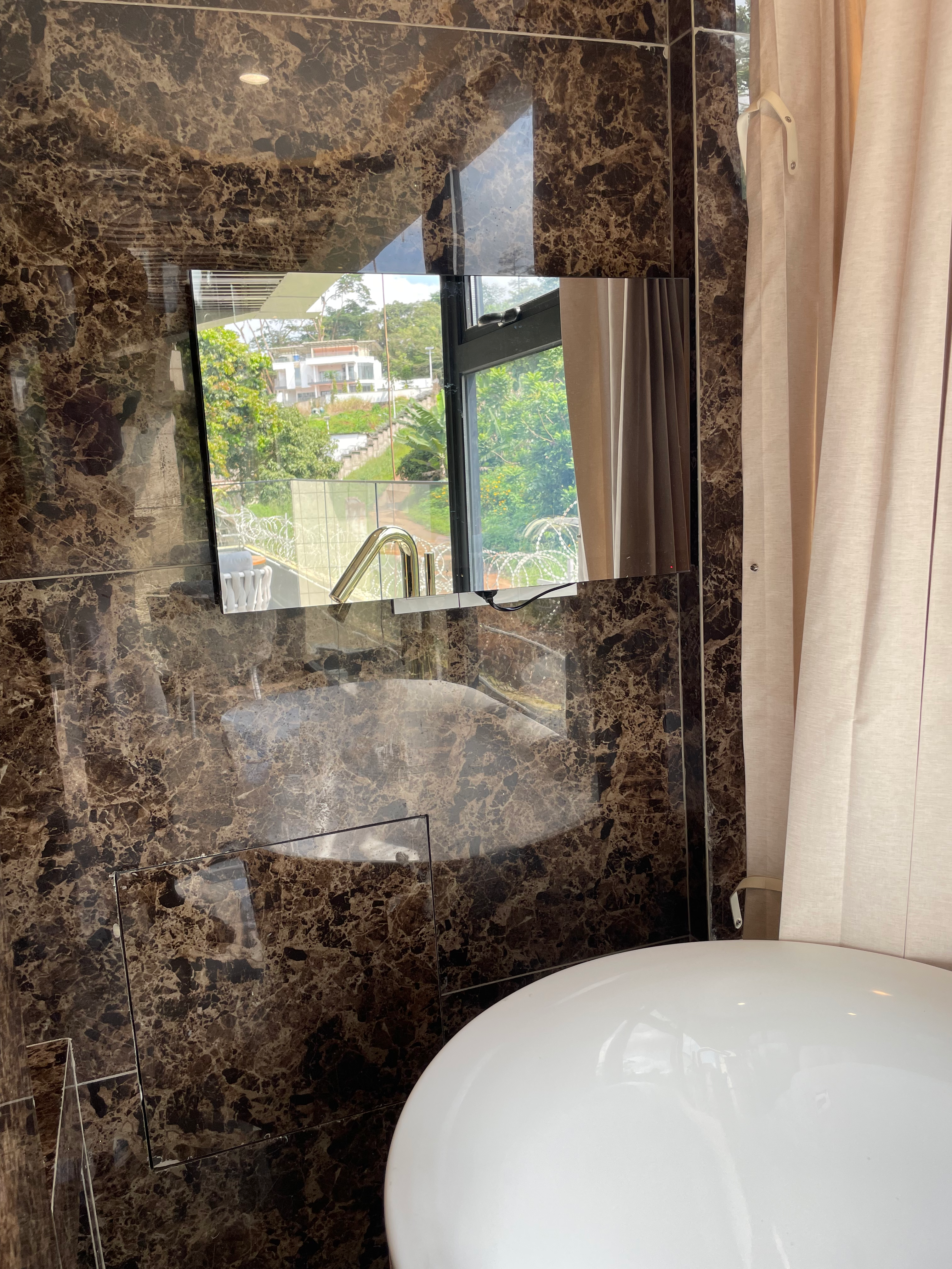 Mirror TV in bathroom - reflects when off, displays when on