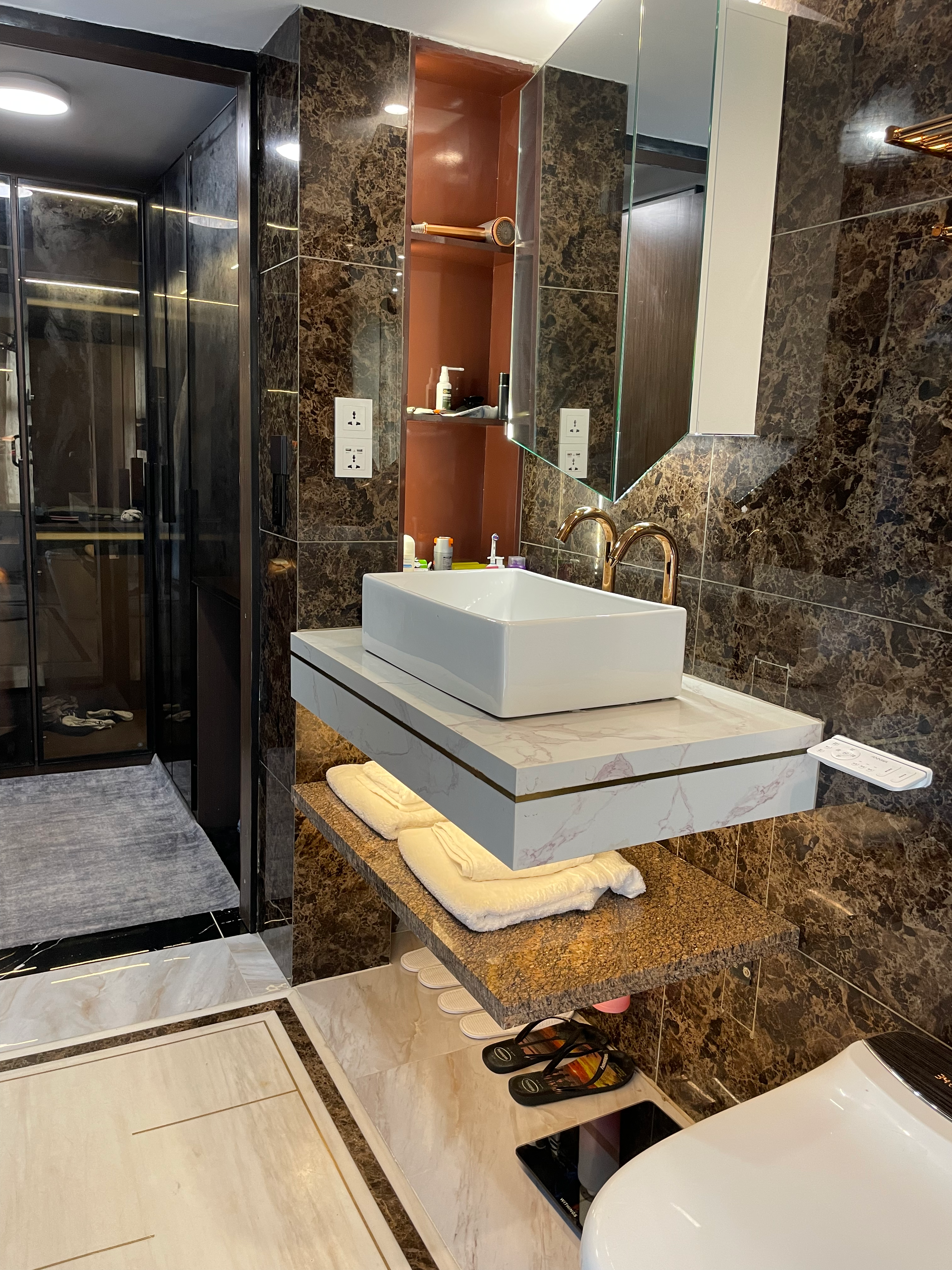Bathroom vanity with gold trim and luxury finishes