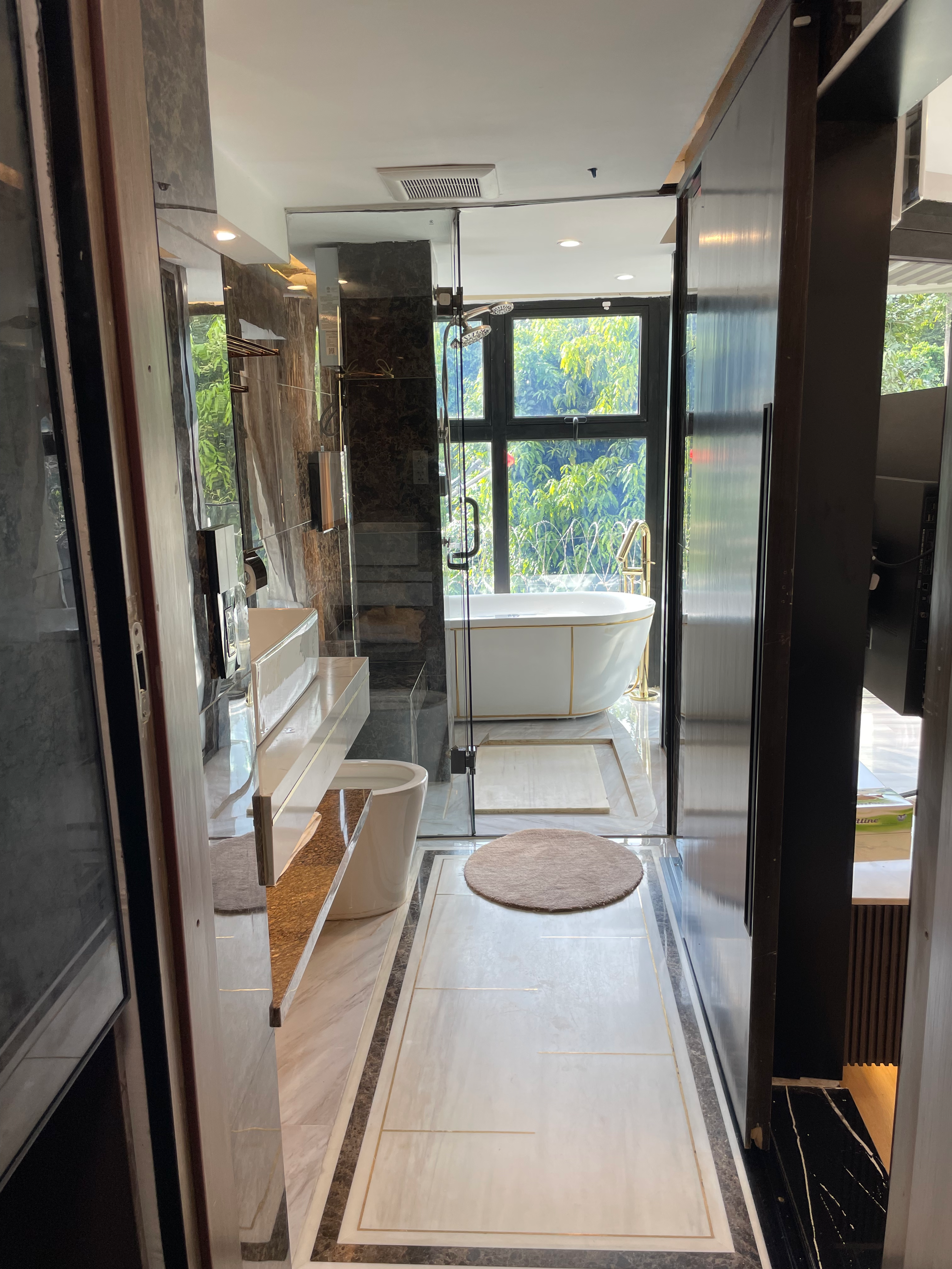 Bathroom view from bedroom showing open suite layout