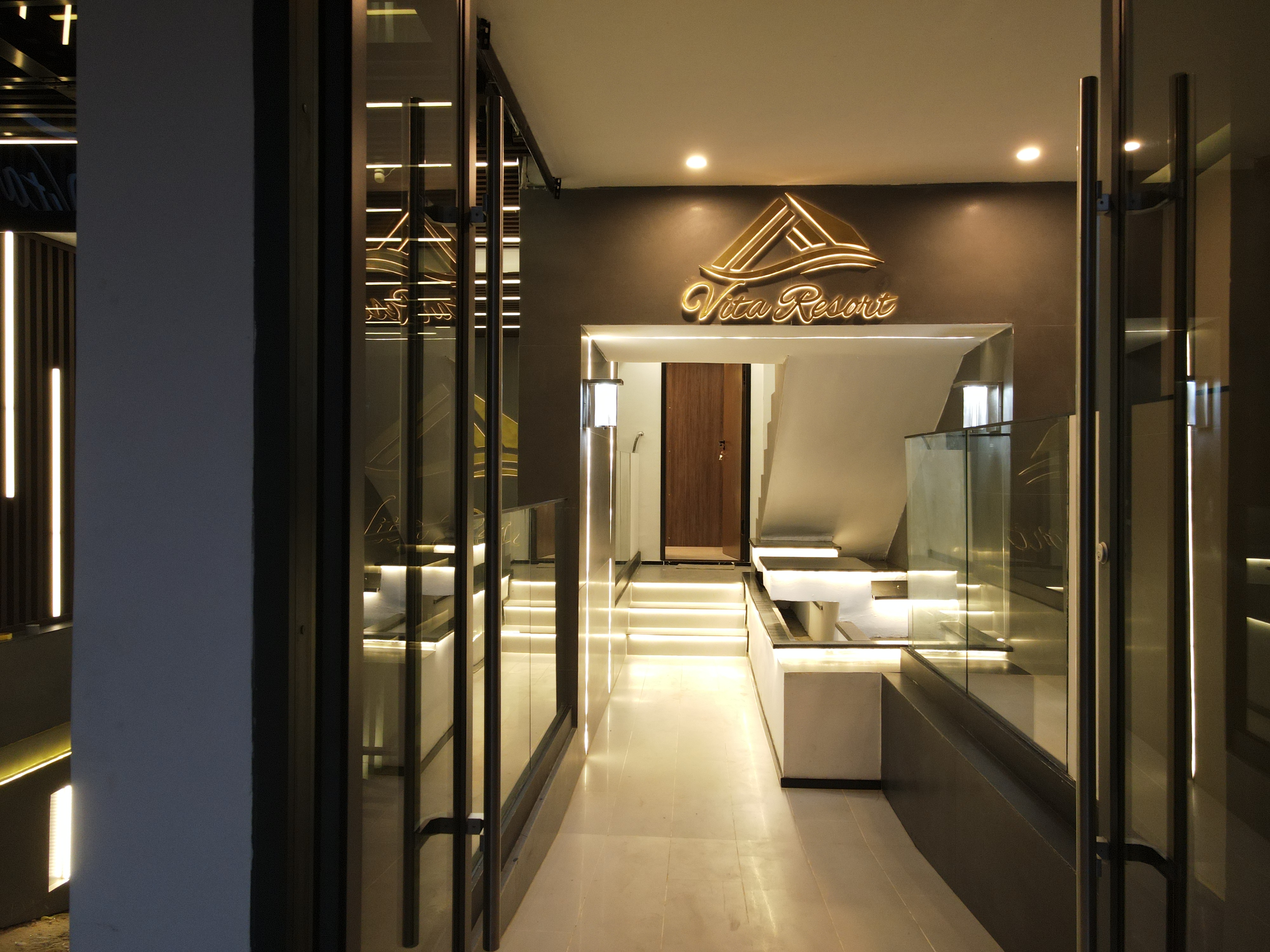 Vita Resort entrance with golden signage close-up