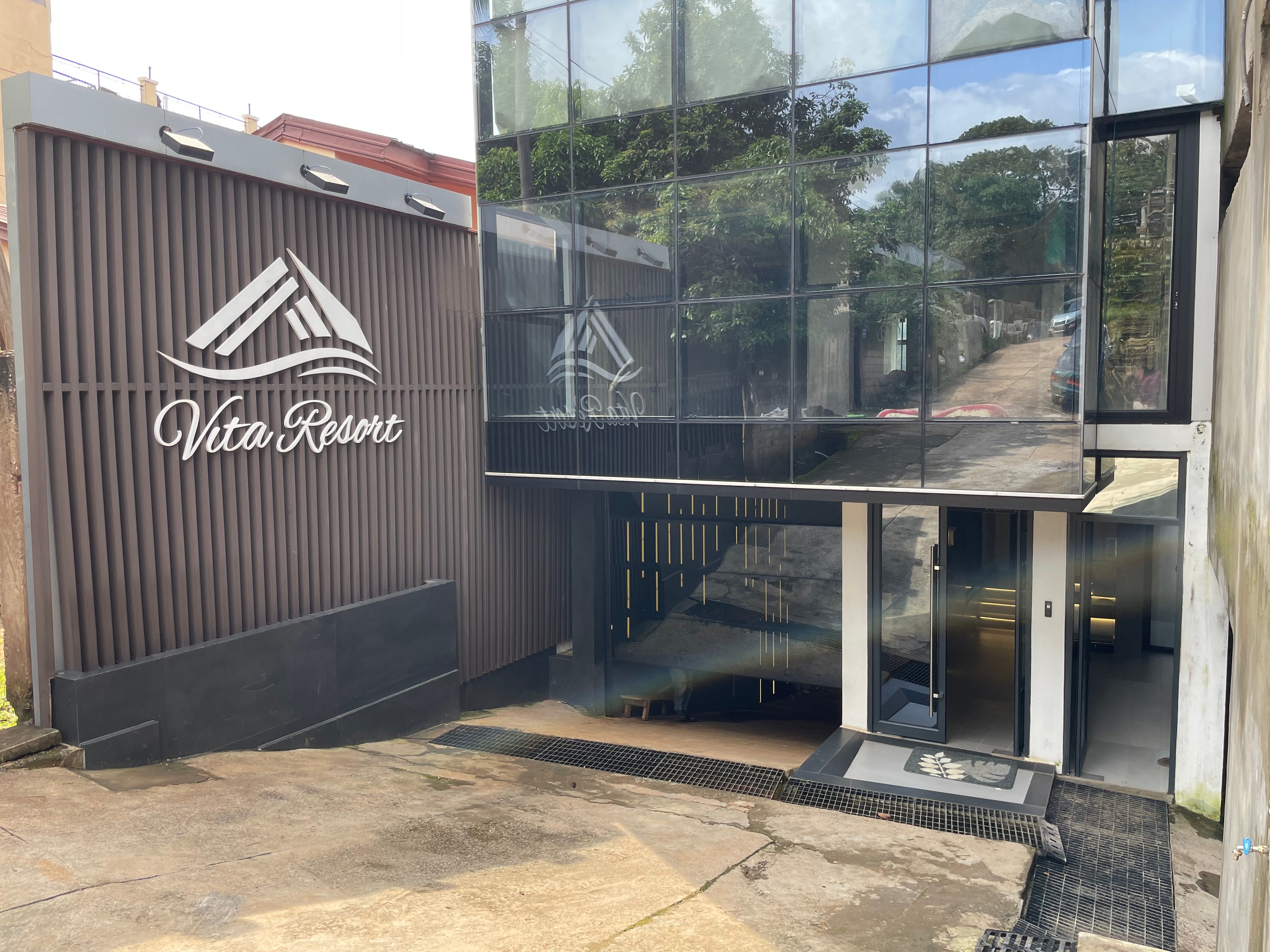 Daytime exterior with Vita Resort branding visible