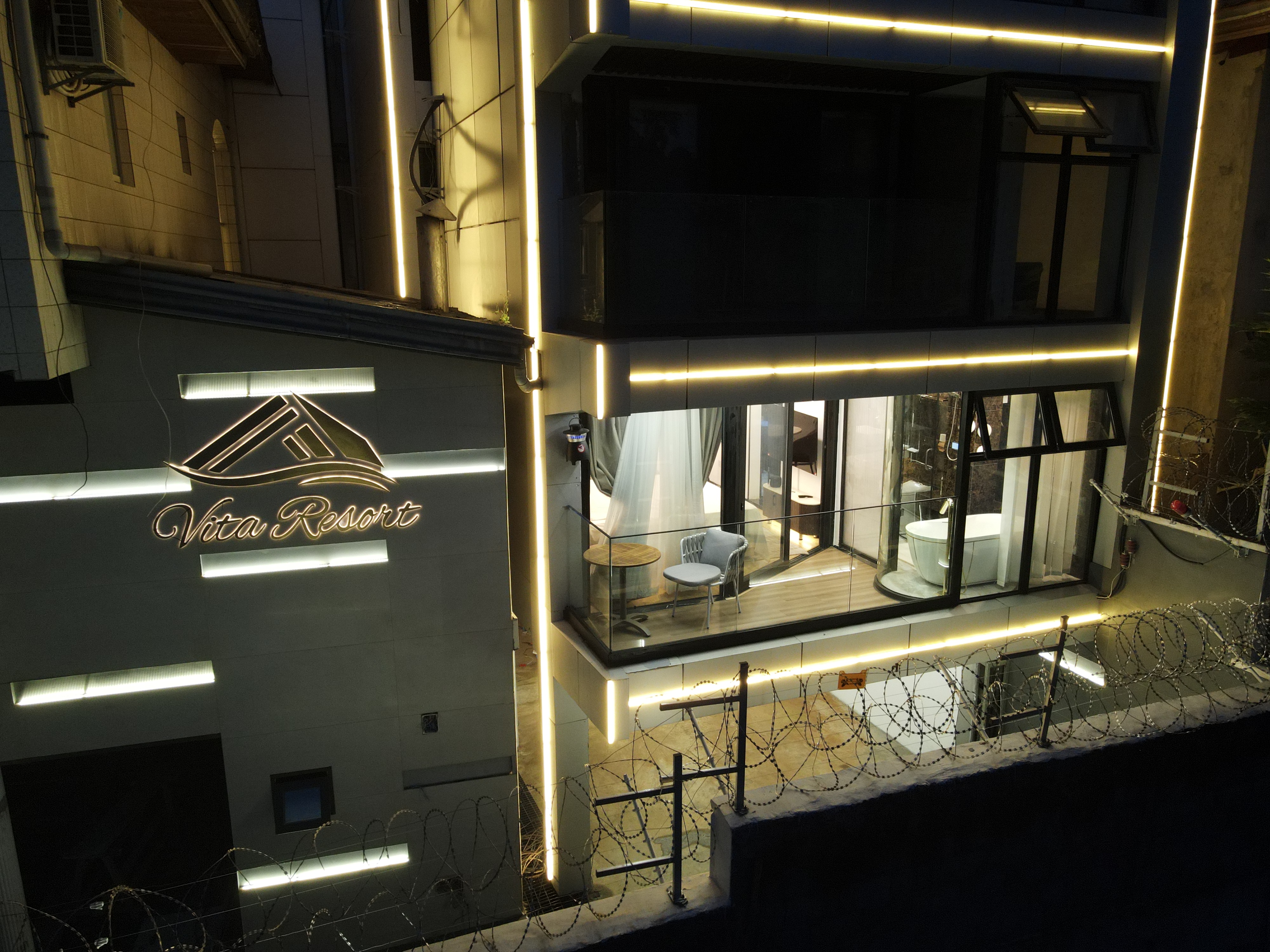 Aerial drone view showing balcony and greenery details