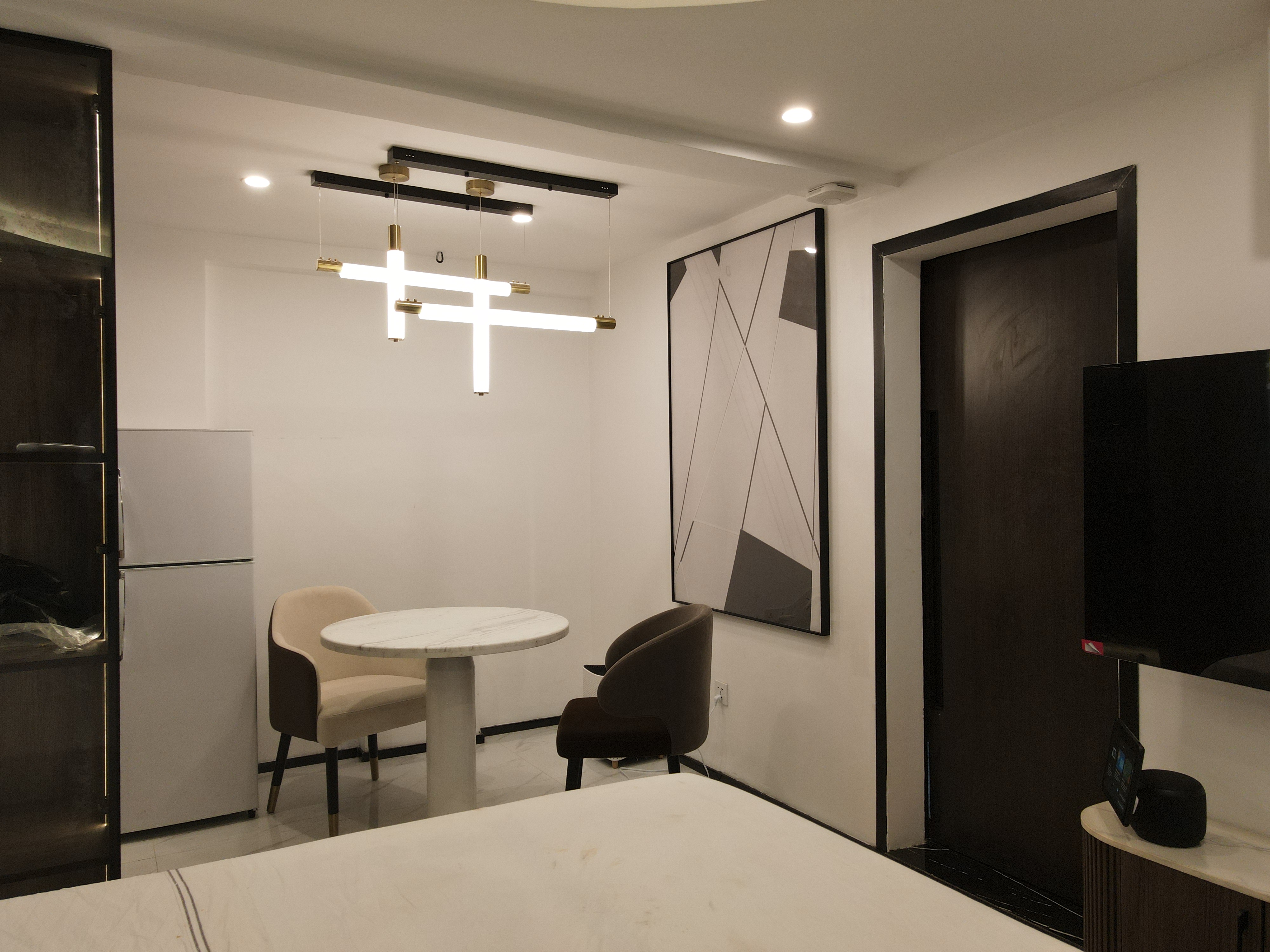 Evening dining area with chandelier illuminated